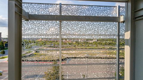 Looking Out Through the Perforated Metal Cladding for The Lakes at Tech Ridge