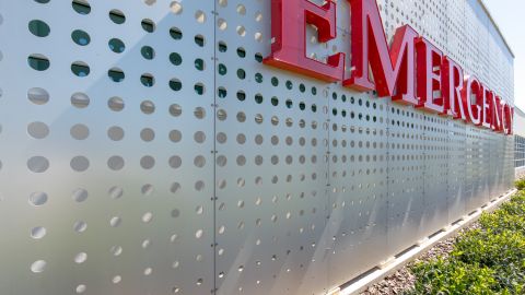 Close Up of the Perforated Metal Façade and Emergency Sign