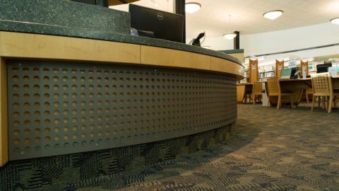 Green Curved Perforated Metal Installed at the WPR Library