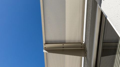 Perforated Metal Sunshades and a Blue Sky