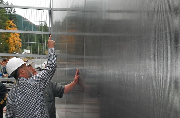 Hendrick inspects a fish screen after installation